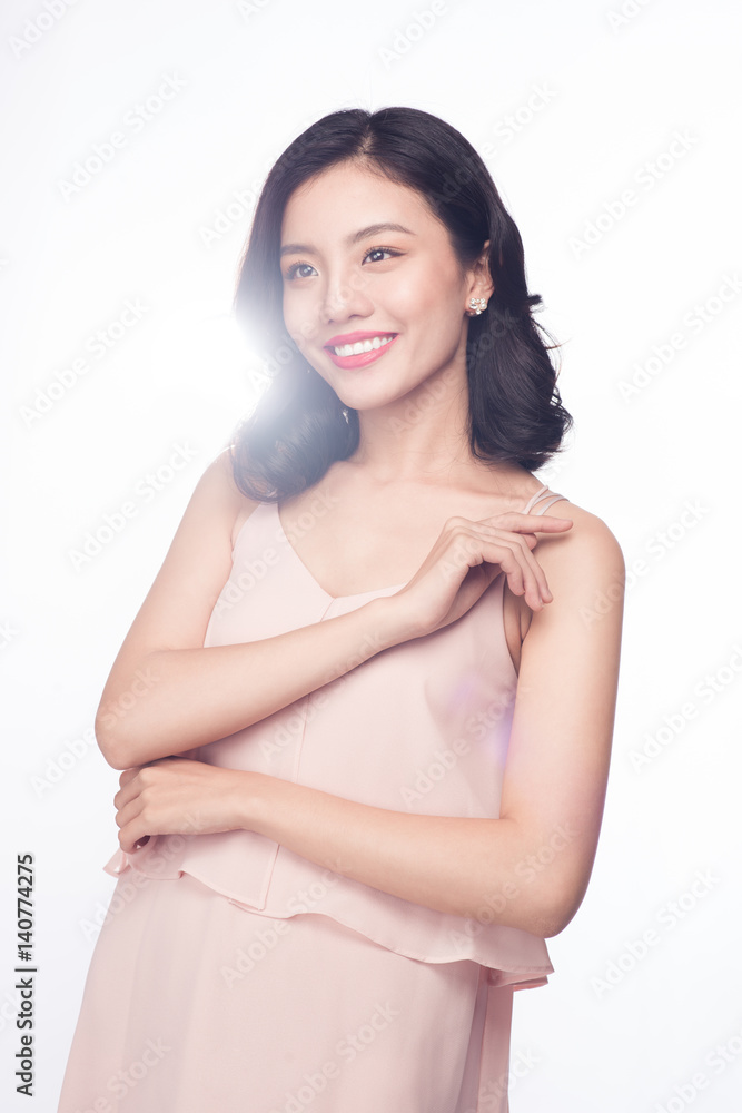 Beautiful happy cute asian woman in casual pink dress with red lips on white background Beautiful happy cute asian woman in casual pink dress with red lips on white background
