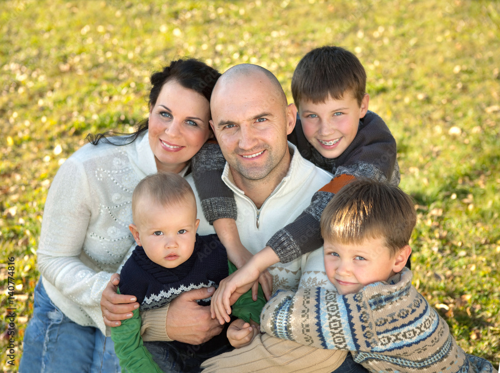 Happy family, father, mother and four sons photo in nature Happy family, father, mother and four sons photo in nature