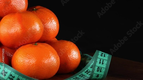 1920x1080 25 Fps. Very Nice Mandarin And Tape Measure Turning 9 Video photo