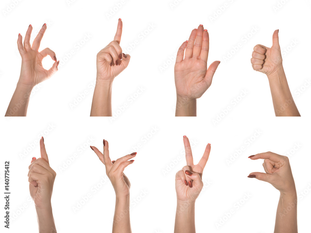 Female hand on a white background shows different gestures. Female hand on a white background shows different gestures.