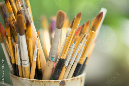 Photo of paint brushes in a jar
