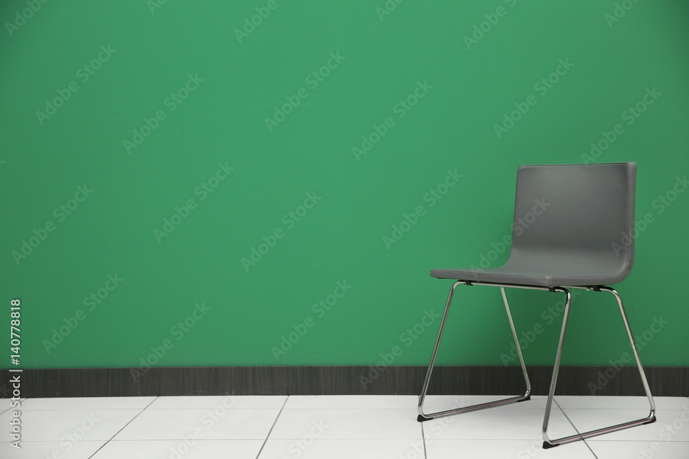 Chair on color wall background Chair on color wall background