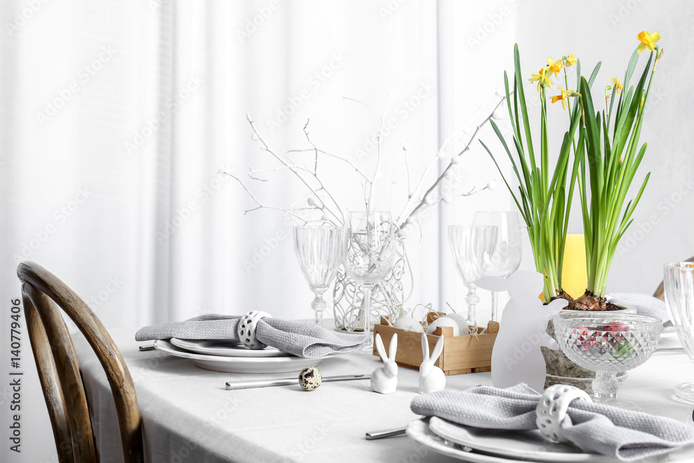 Fototapeta premium Beautiful Easter table setting in light room