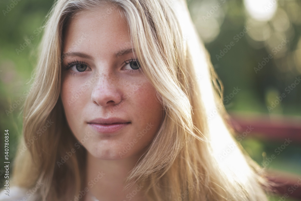 Close-up portrait of teenage girl in back yard Close-up portrait of teenage girl in back yard