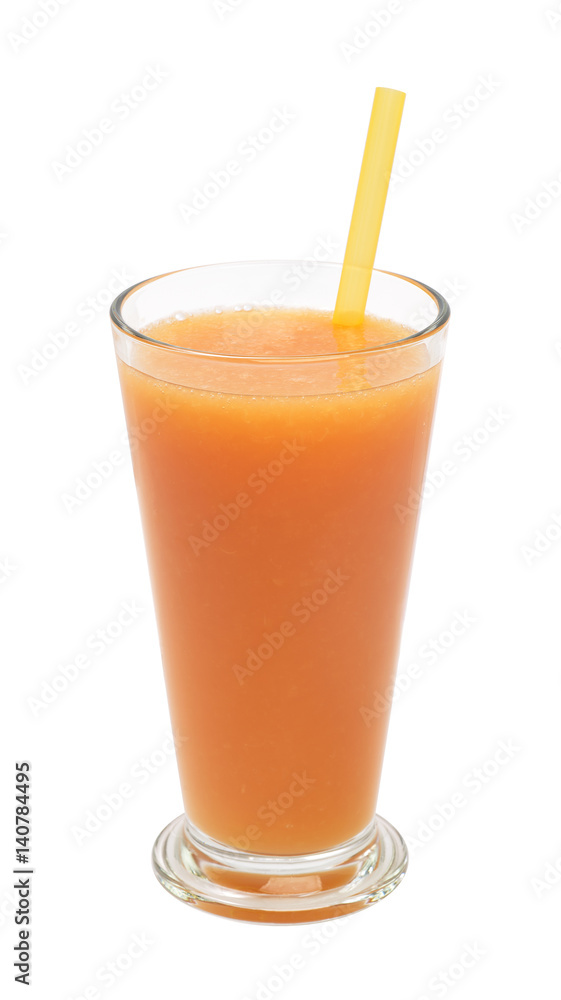 freshly grapefruit juice in a glass with straw on a white background freshly grapefruit juice in a glass with straw on a white background