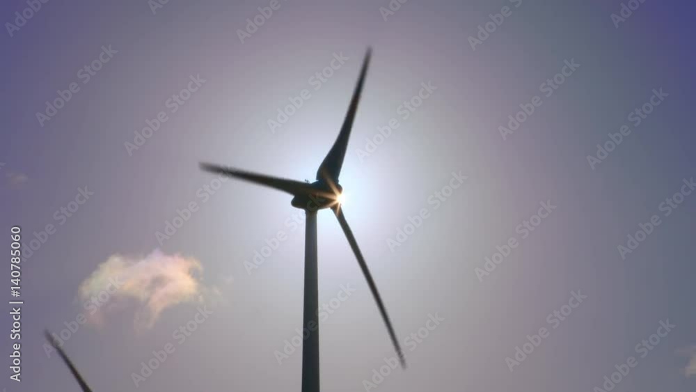 Sunrise Behind the Turnstile of a Wind Turbine Timelapse The picture is highly contrasted. The sun is getting bigger and bigger. Sunrise Behind the Turnstile of a Wind Turbine Timelapse The picture is highly contrasted. The sun is getting bigger and bigger.