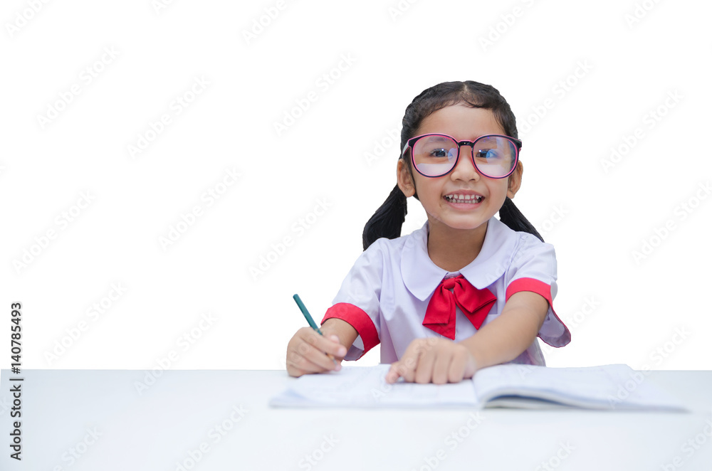 Asian little girl doing homework with smile isolated on white background with clipping path Asian little girl doing homework with smile isolated on white background with clipping path