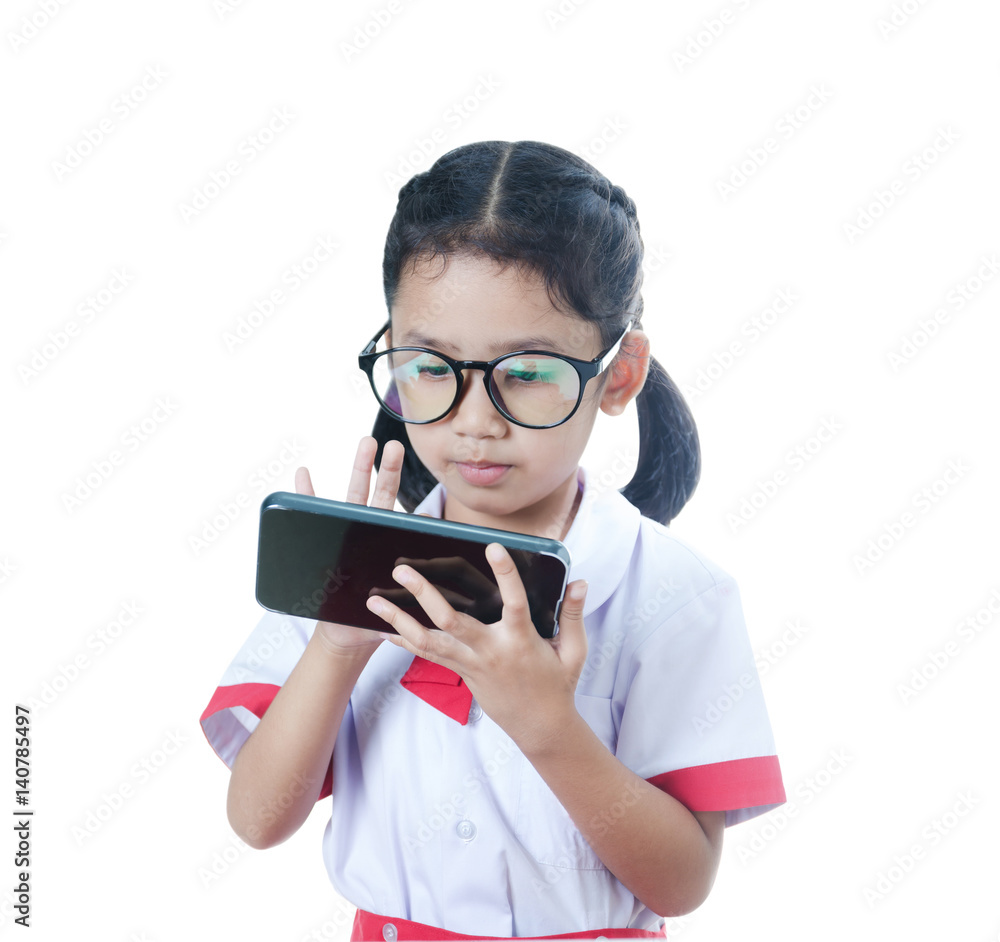 Asian little girl in student uniform using smartphone isolated on white background