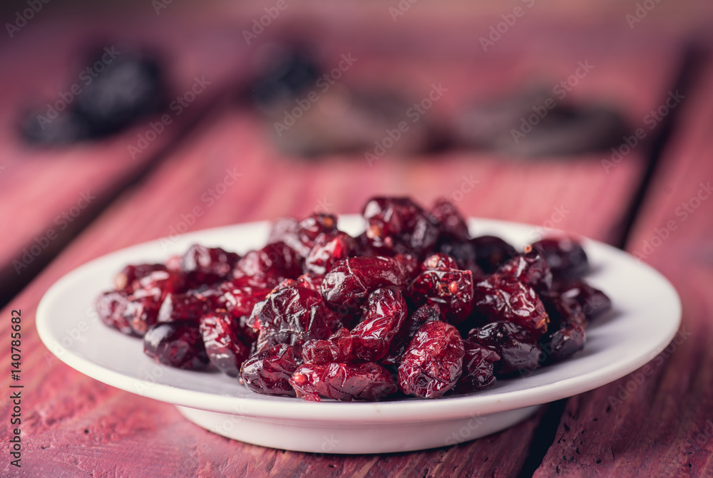 Dried cranberries on the plate Dried cranberries on the plate