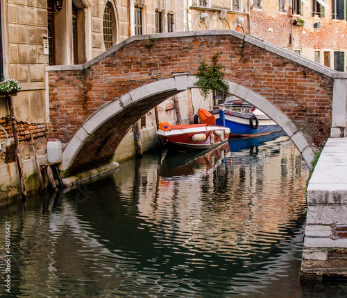 Boats back of on of the venetian bridge