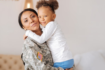 Lively child and her mother enjoying their reunion