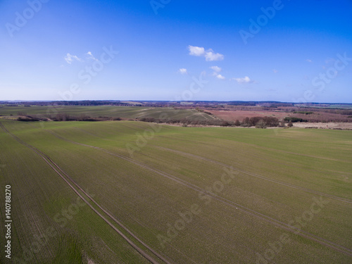 Aerial view of agricultural fields in spring with blue sky - germany