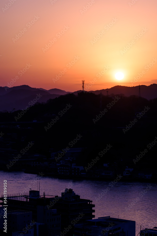 Silhouette of mountains and town at the dawn