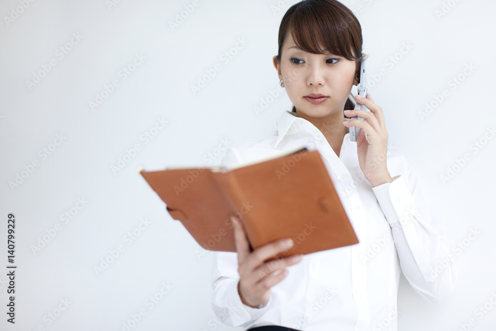 Young businesswoman on a cell phone Young businesswoman on a cell phone