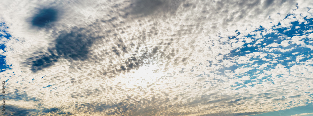 Panoramic view of small clouds in the blue sky