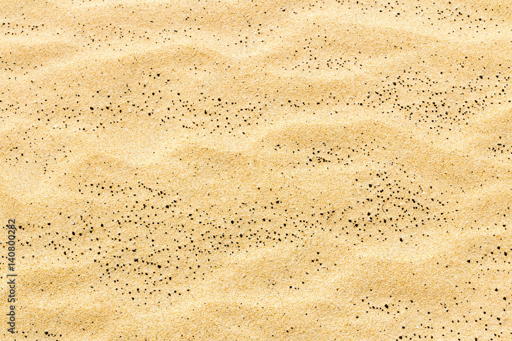 Closeup of sand texture pattern of a beach in the summer Closeup of sand texture pattern of a beach in the summer