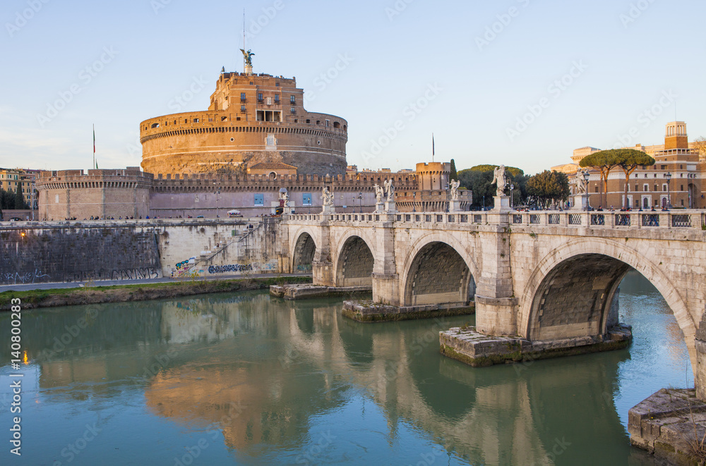 Castle of Holy Angel (Castel Sant Angelo)  and Holy Angel Bridge over the Tiber River in Rome at sunset. Italy, Europe 