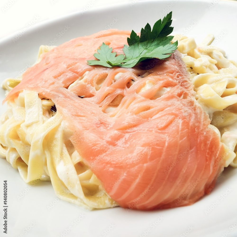 tasty pasta with salmon on a the table tasty pasta with salmon on a the table