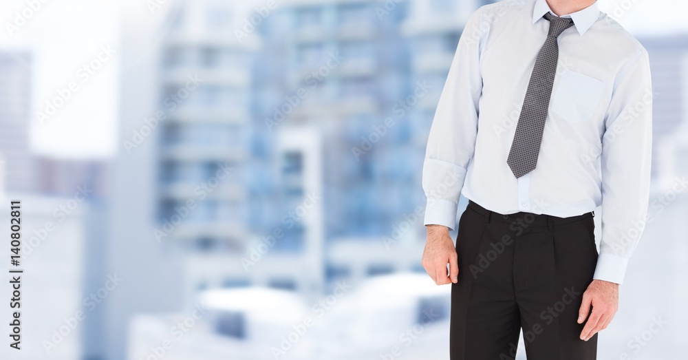 Businessman Torso against building background Businessman Torso against building background