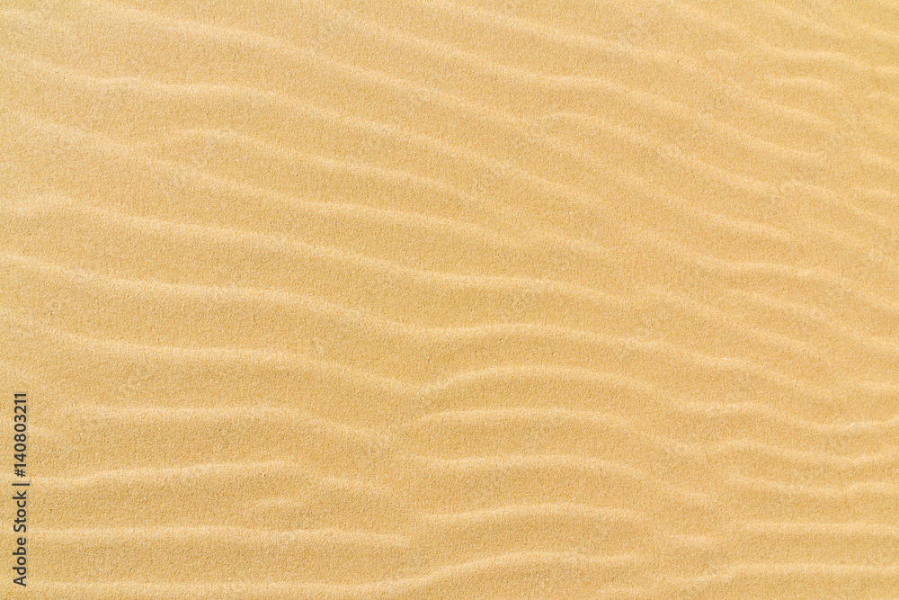Closeup of sand texture pattern of a beach in the summer Closeup of sand texture pattern of a beach in the summer