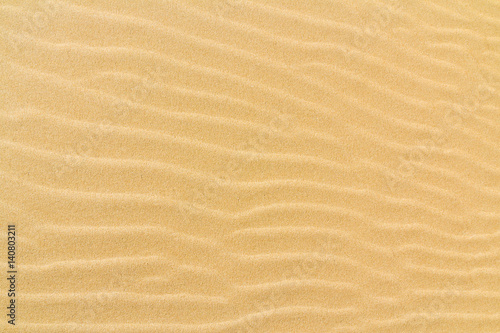 Closeup of sand texture pattern of a beach in the summer