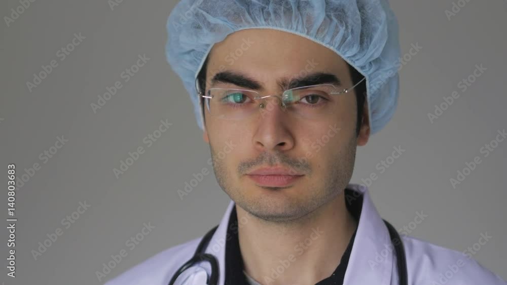 Young doctor looking directly at the camera Young doctor looking directly at the camera