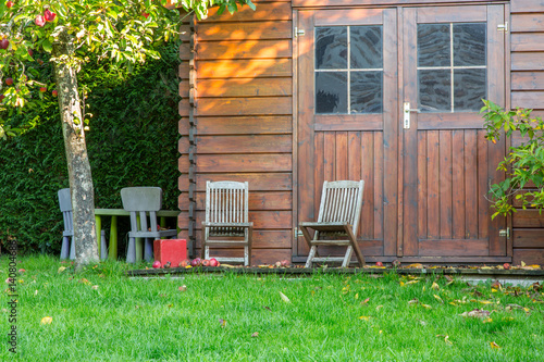 Wooden garden tool shed in a beautiful park