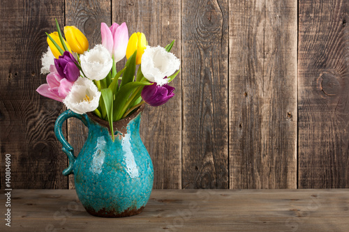 Fresh colorful tulips bouquet in jug