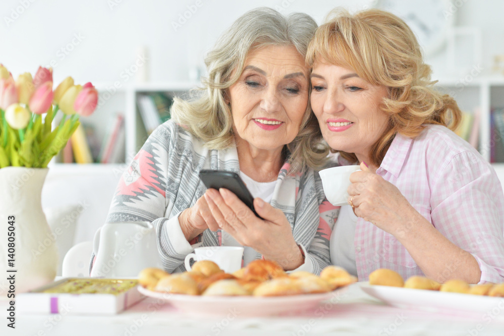 Two beautiful mature women having breakfast Two beautiful mature women having breakfast