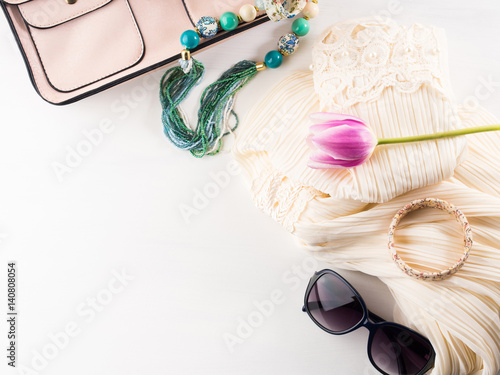 Woman clothes accessories fashion shopping. Romantic dress outfit with glasses and necklace bracelets. Summer elegant style look flat lay for blog lifestyle on white background