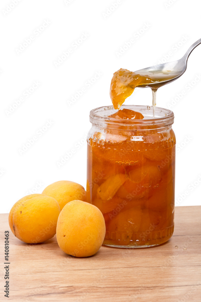 Fresh apricots and glass jam in a jar Fresh apricots and glass jam in a jar