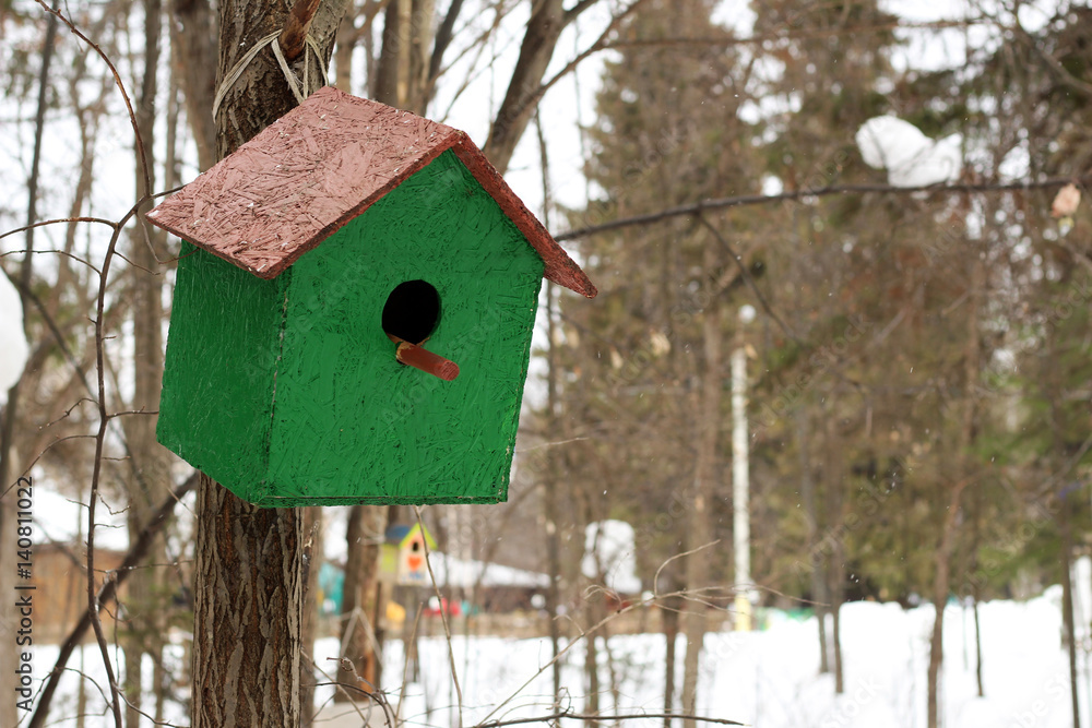 Wooden birdhouse in the forest, handmade