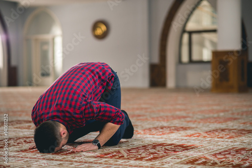 Muslim man prostrating 