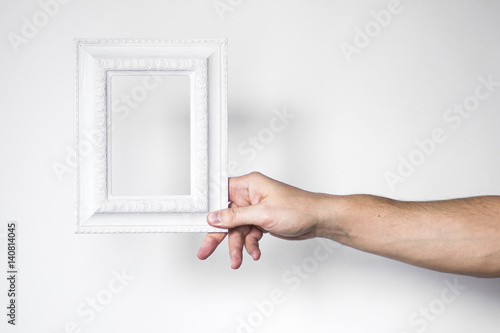 white frame in the hand vintage frame