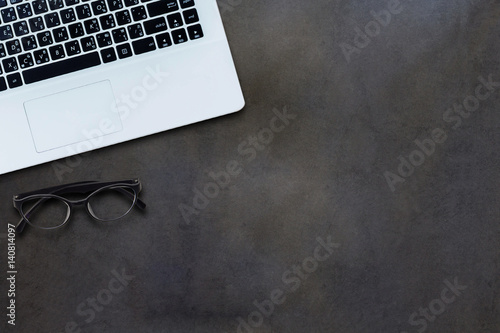 White computer and eye glasses ,top view background