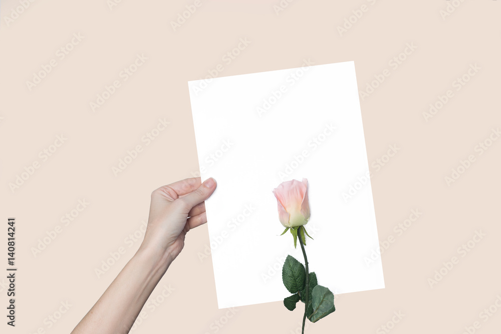 a sheet of paper in his hand, on a background a sheet of paper in his hand, on a background