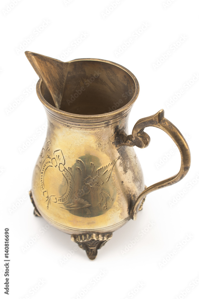 Antique silver jug for milk isolated on white Antique silver jug for milk isolated on white