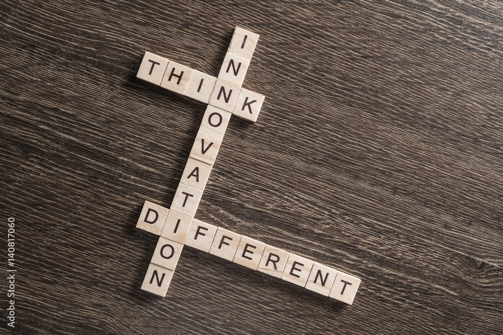 Conceptual business keywords on table with elements of game making crossword Conceptual business keywords on table with elements of game making crossword