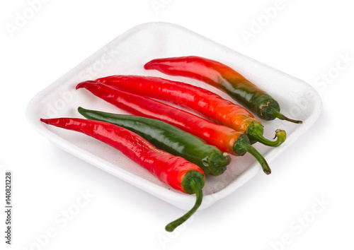 Hot red chilli peppers on market tray