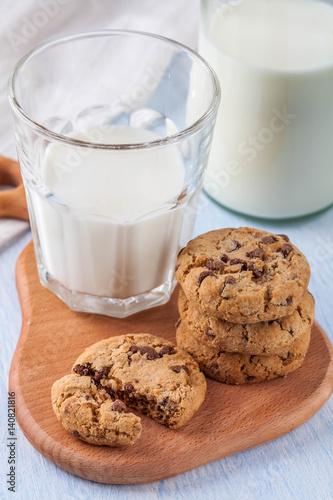 cookies with chocolate chips and a glass of milk