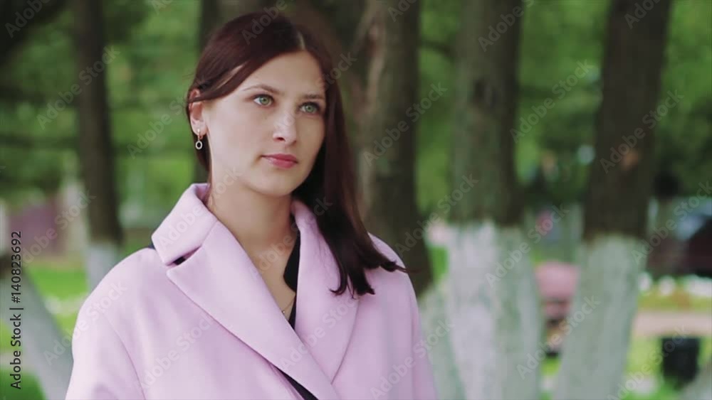 Pensive Look of a Young Dark-Haired Girl in Park Pensive Look of a Young Dark-Haired Girl in Park