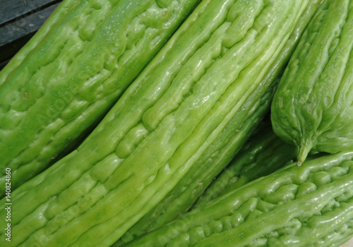 Vibrant green Bitter Cucumber, Bitter Gourd, Balsam pear, closed up for texture, background