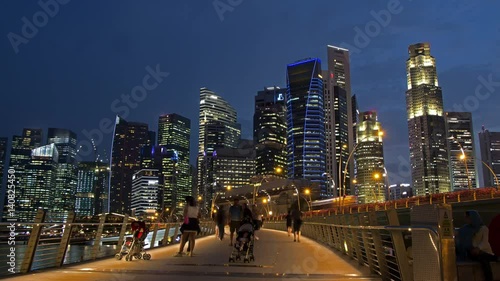 Timelapse of People and Singapore Business District at Dusk
