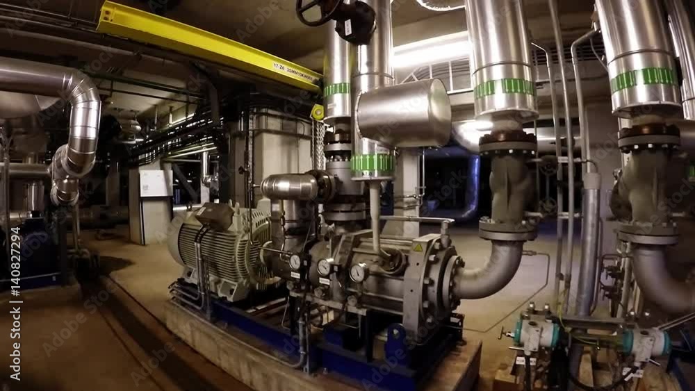 Equipment, cables and piping as found inside of a modern industrial power plant
Equipment, cables and piping as found inside of a modern industrial power plant