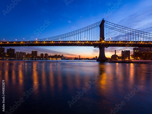 Bridge silhouetted against dawn sky