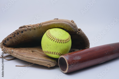 Ball in glove with wood bat