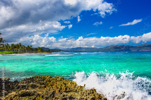 Caribbean sea surface summer wave background. Exotic water landscape with clouds on horizon. Natural tropical water paradise. Dominican Republic nature relax. Travel tropical island resort. Ocean natu