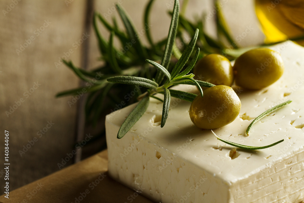Fresh tasty greek green olives with cheese feta or goat cheese. Closeup. Mediterranean food.Horizontal. Fresh tasty greek green olives with cheese feta or goat cheese. Closeup. Mediterranean food.Horizontal.