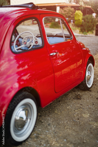 Cute vintage car parked by the road