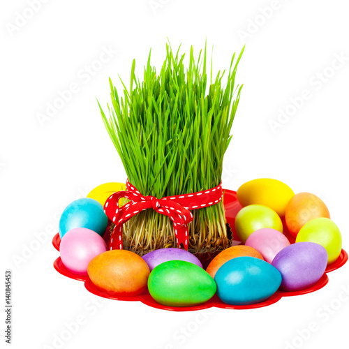 Colored eggs, wheat springs on Nowruz holiday on white background. Selective focus.